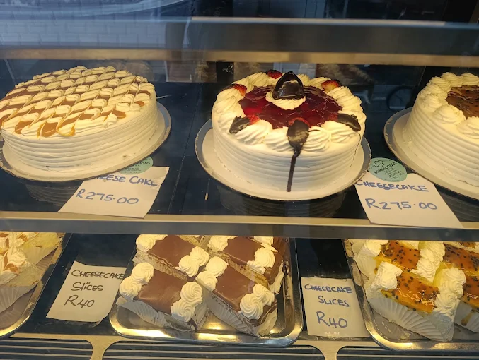 Freshly decorated cheesecakes on display at Bombalicious Bakes