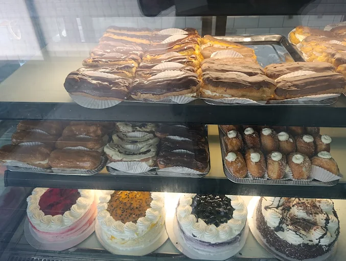 Chocolate-dipped eclairs and cream doughnuts